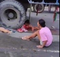 Woman Crushed Under Truck Wheels