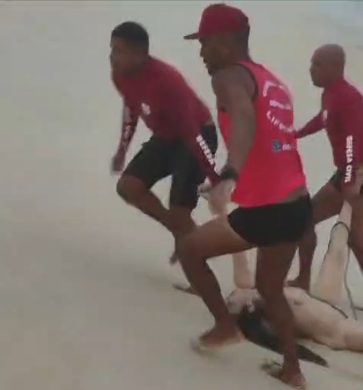 Drowned Woman Pulled From Sea by Group of Guys