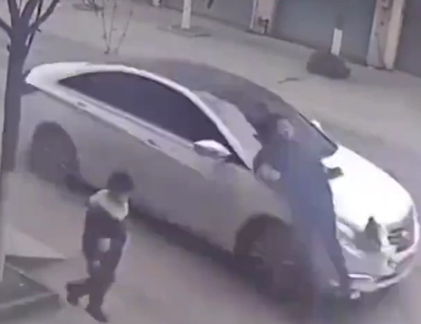 Chinese man horrifically crashed by speeding car in front of his son 