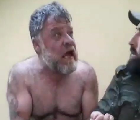 One of the Syrian Regime butcher captured and tortured by rebels 