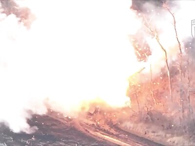 A burning crew member of a Russian T-90M Proryv jumps out of the tank