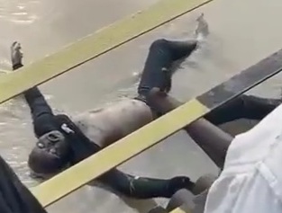 Rotten drowned body floating in river 