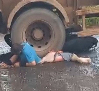 man crushed by dump truck