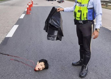 Decapitated head of motorcyclist after a deadly accident 