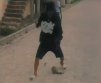 Gang Member Plays Soccer with a Rivals Head 