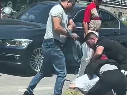 two people got out of their car and beat up the motorcyclist 