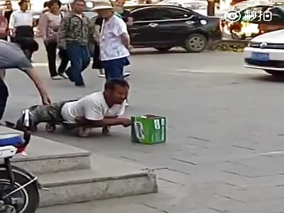 Panhandling Scammer Suddenly Grows Legs!