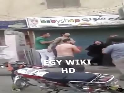 lady rescues a young man to death after a battle with swords