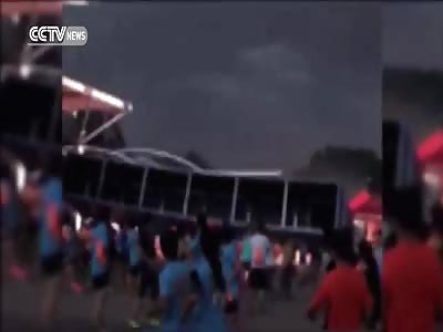Strong wind topples billboard, hurts passersby in Beijing. 