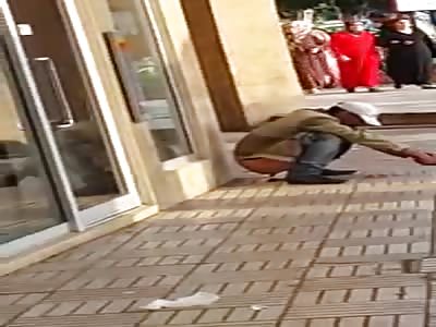 man practicing yoga in the street