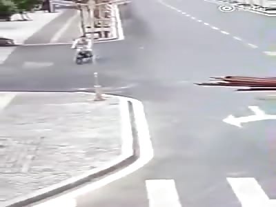 Biker hit to ground by pole knocked down by oversize tractor