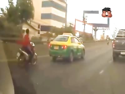 Biker eats the back of a taxi 
