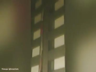 Desperate residents trapped in tower make ropes form blankets