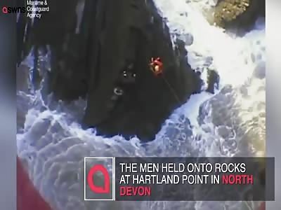 Incredible scenes as two young men rescued by Coastguard winchman are battered by massive waves