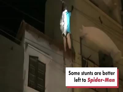 Escaped patient dangles dangerously from power lines