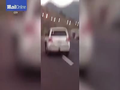 Shocking video shows girl HANGING outside window of moving car