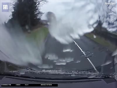 Driver cheats death after huge metal pole strikes front of car