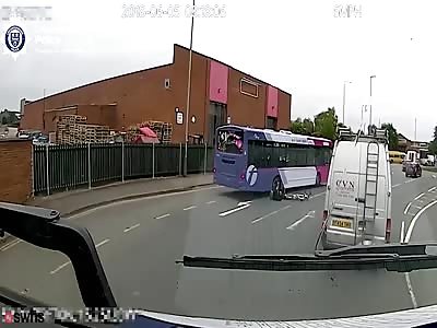 Cyclist comes inches from death after being crushed by a car and a bus