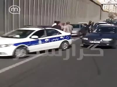 Iranian policeman beat the shit out of two woman