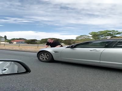 dude wants to be run over, then punches a window.