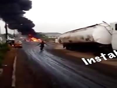 burned man running in the street after bus accident