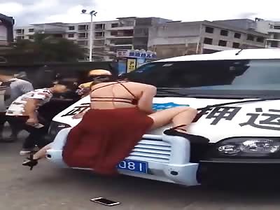 Mad drunk prostitute stopping traffic 