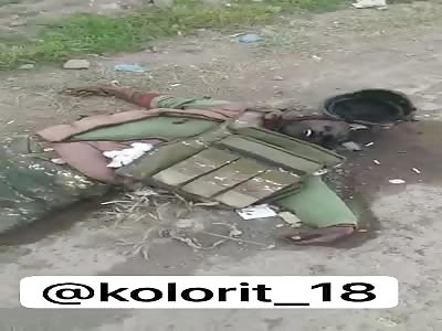 Body of killed Armenian soldier lying on the side of the road 