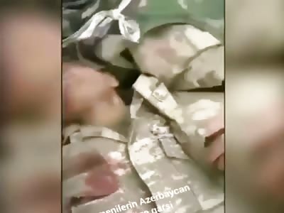 Azerbaijani soldier slapping multiple faces of dead Armenian soldiers 
