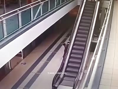 Little boy falls from escalator 