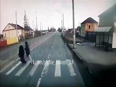 Female driver hit two young women crossing the road 