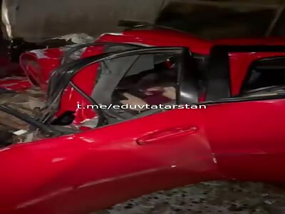 Russian young man trapped in his crushed car