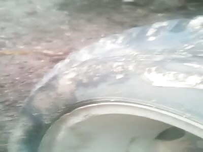 Young man crashed under big loaded truck 