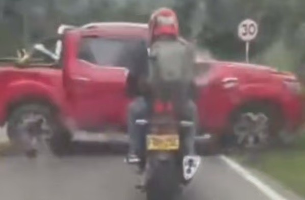 Motorcyclist Surprised By Pickup Truck
