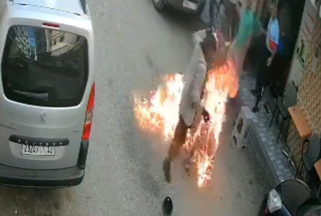 Man is roasted in the street.