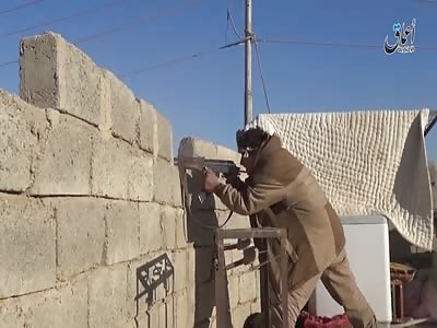 Fights and dead soldiers of the Iraqi army and equipment that remain in the Masaid village to the southwest of Mosul.