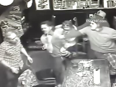 A father has been accused of participating in a violent fight at the bar while holding his four-year-old daughter.