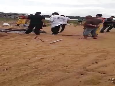 Body and found buried in the sand of the beach with just the feet out 