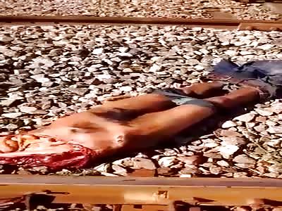 Young totally in pieces. On the train tracks