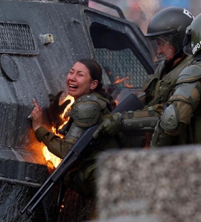CHILE: Two Female Cop Set on Fire by Molotov Cocktails During Protests