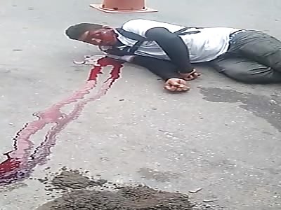 man in agony after being shot