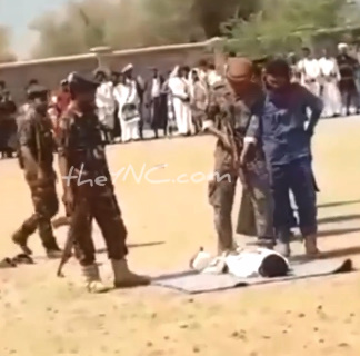 EXECUTED BY MACHINE GUN FOR A HAPPY CROWD