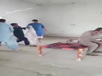 Gay couple are punished with flip-flops.