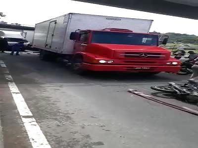 BRUTAL,  biker in agony with shattered hand.