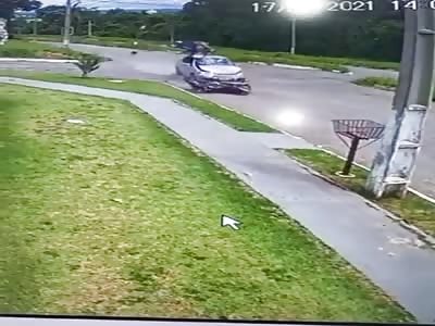 CCTV. motorcyclist is hit by car