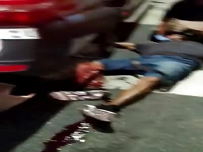 Motorcyclist is crushed by bus.