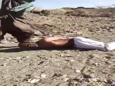 TERRORIST TENDERIZES BLACK MEAT WITH A STICK