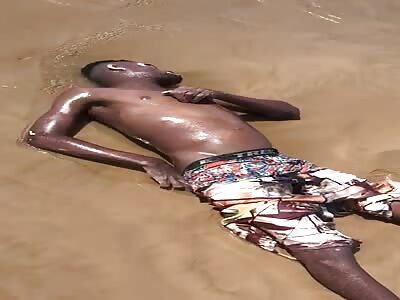 by the shore of the beach drowned man 