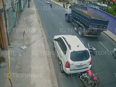 Biker fell under a truck