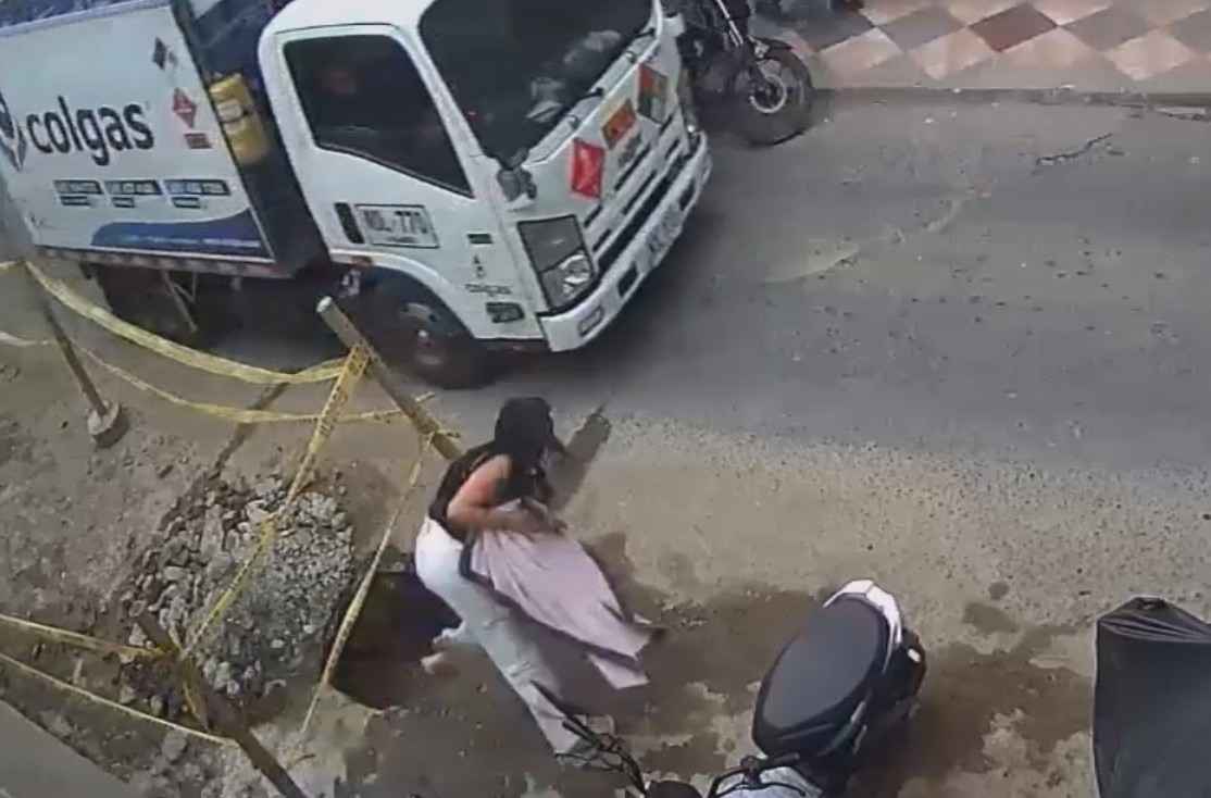 Close Call: Careless Woman Holding Toddler Nearly Dies Under TheTruck 