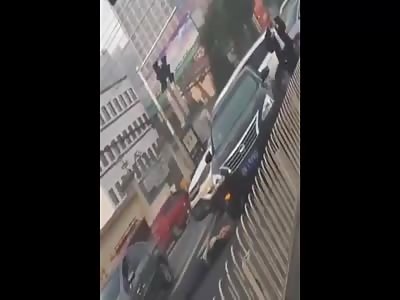 MAN LAYS ON THE GROUND AND GETS RUN OVER